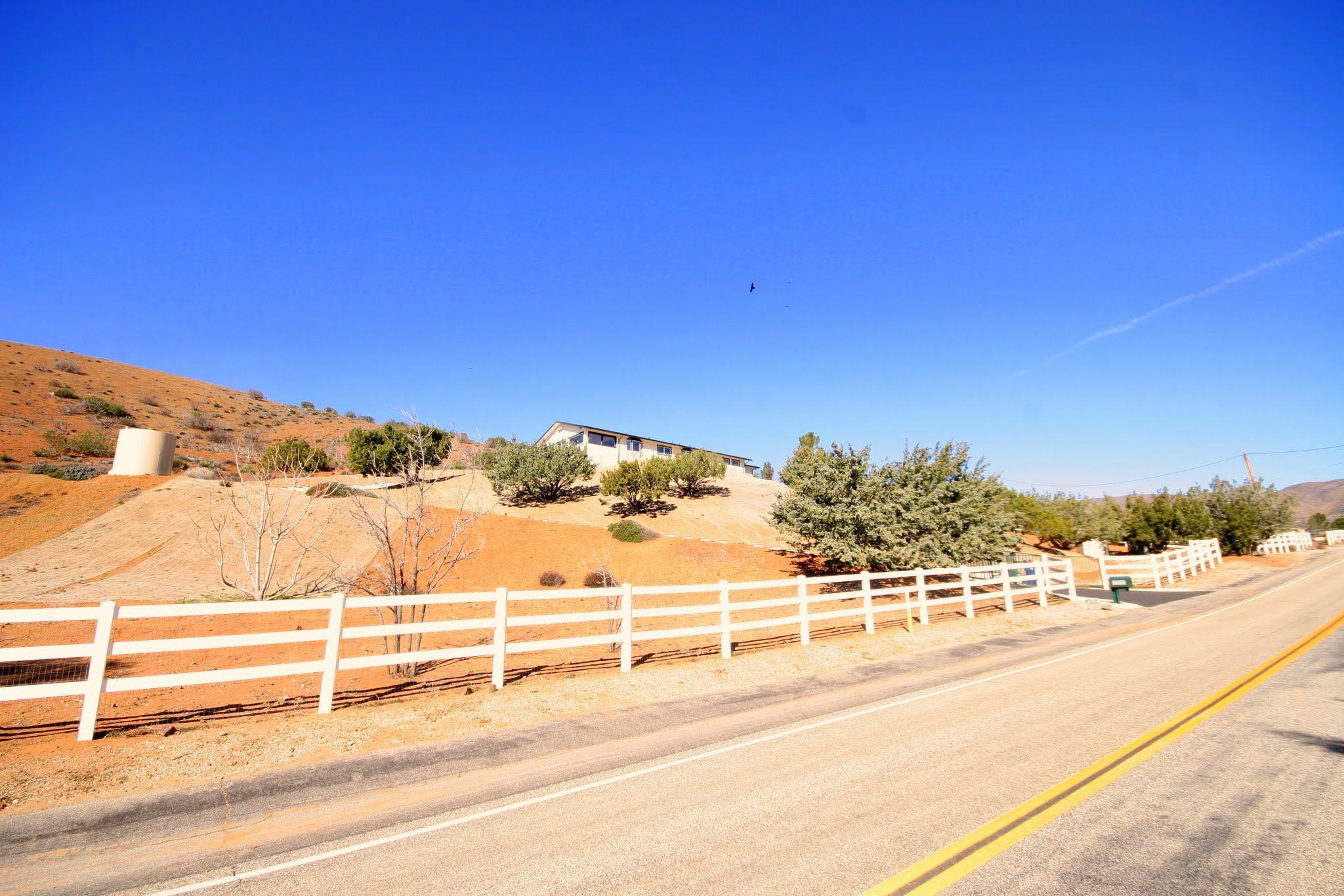 34421 Red Rover Mine Road Acton, CA 93510 - Photo 52 of 52 a view of a parking area with wooden fence