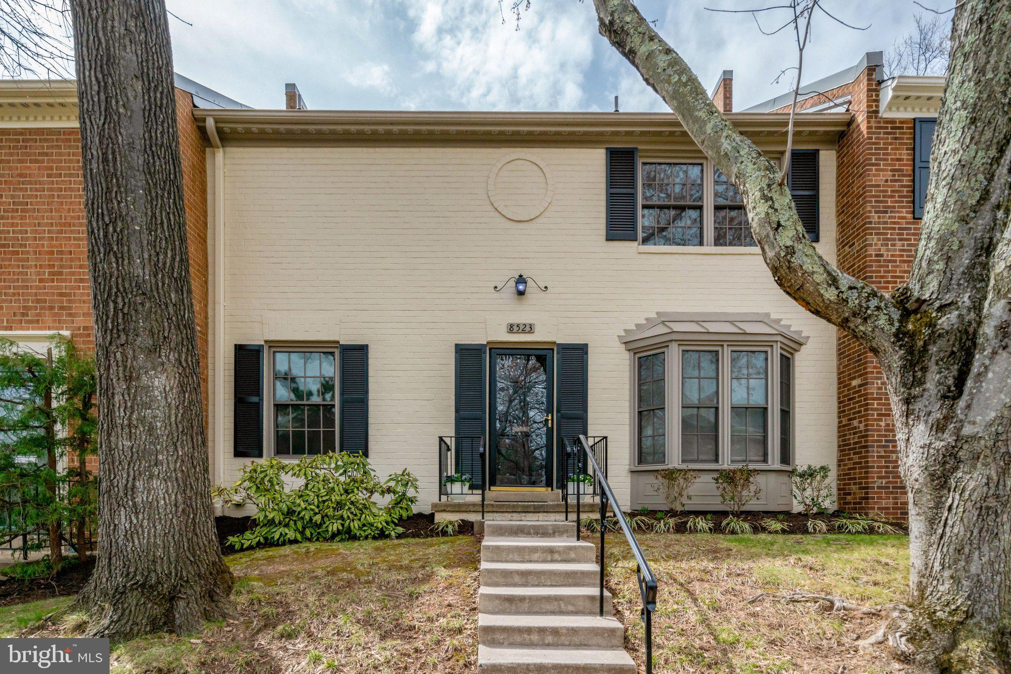8523 Lakinhurst Lane Springfield, VA 22152 - Photo 73 of 77 a front view of a house with a garden