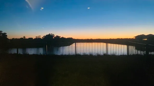 a backyard of a house with wooden floor