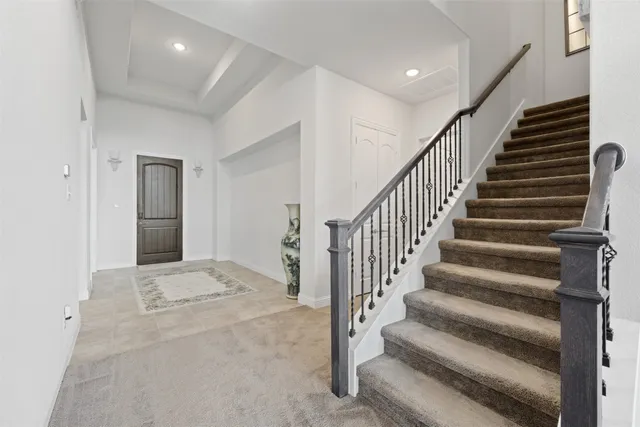 a view of staircase with wooden floor and stairs