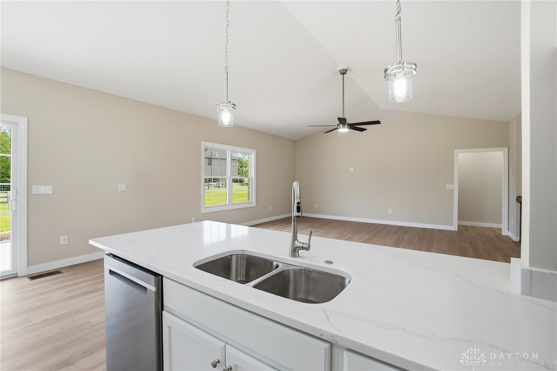 4600 Beal Road Franklin, OH 45005 - Photo 12 of 42 Bright, open concept living area featuring a modern kitchen island and elegant flooring.