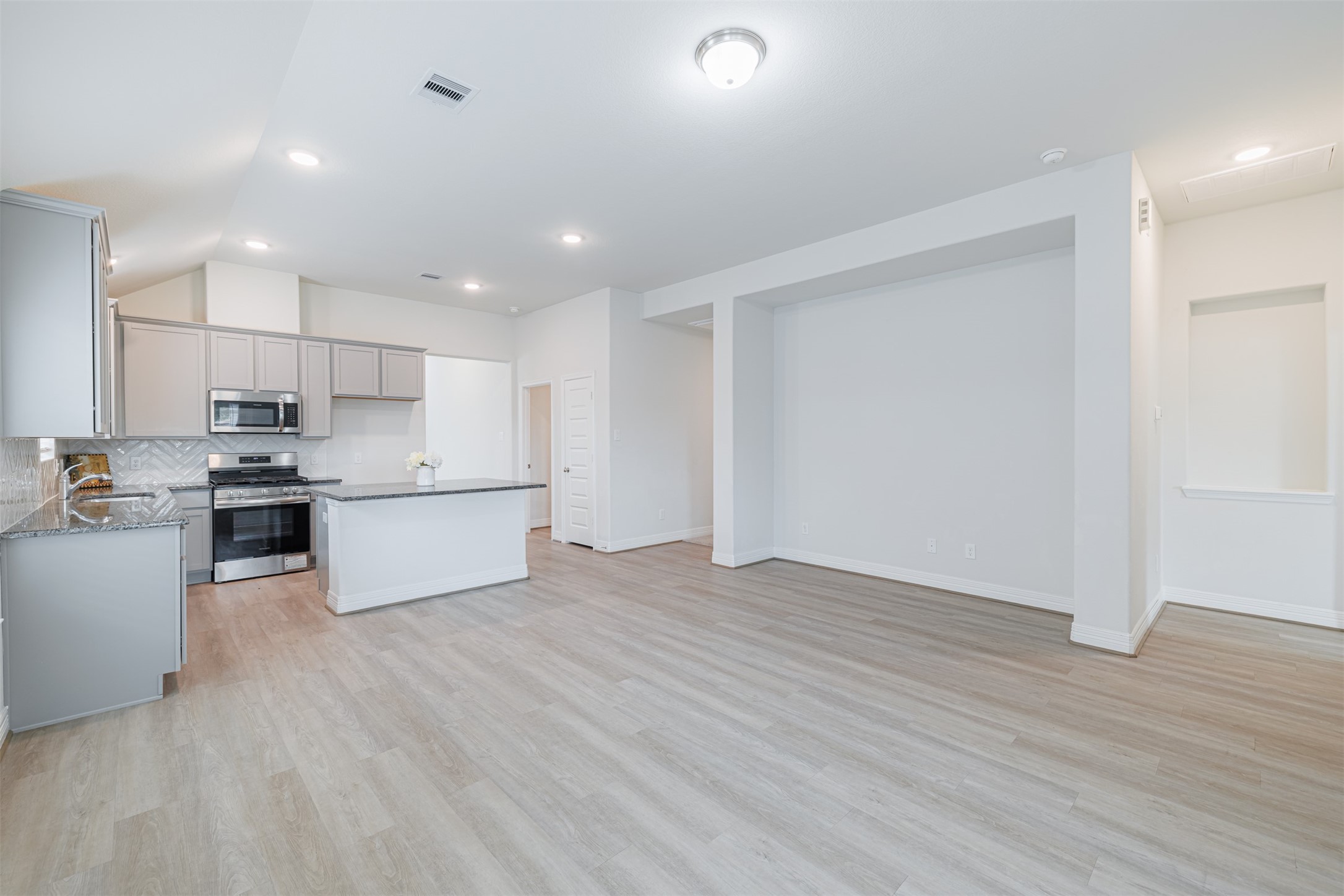 33118 School Hl Road Fulshear, TX 77441 - Photo 12 of 18 a view of kitchen with wooden floor