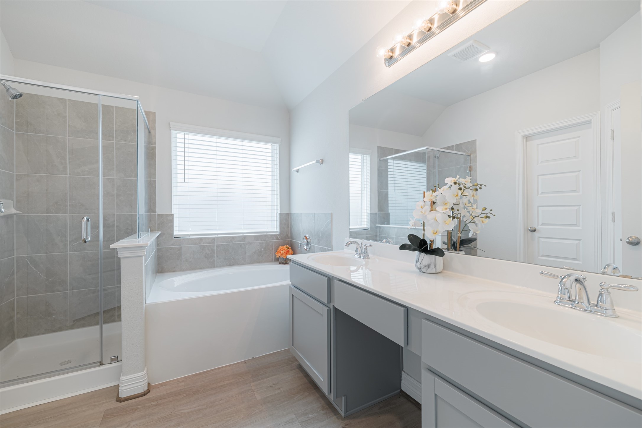 33118 School Hl Road Fulshear, TX 77441 - Photo 14 of 18 a bathroom with a tub sink and mirror