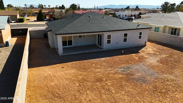 a aerial view of a house with a yard