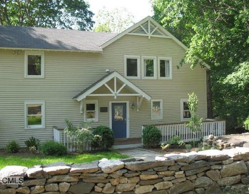 18 Clearview Terrace Ridgefield, CT 06877 - Photo 1 of 1 a front view of a house with a yard
