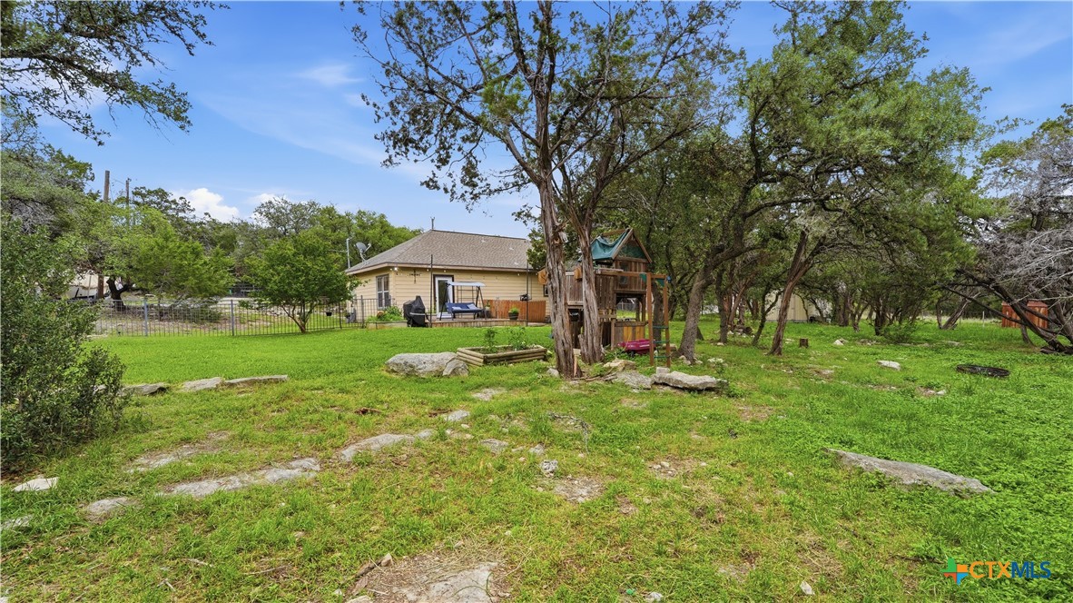 2216 Hornsby Spring Branch, TX 78070 - Photo 26 of 33 a front view of a house with yard and green space