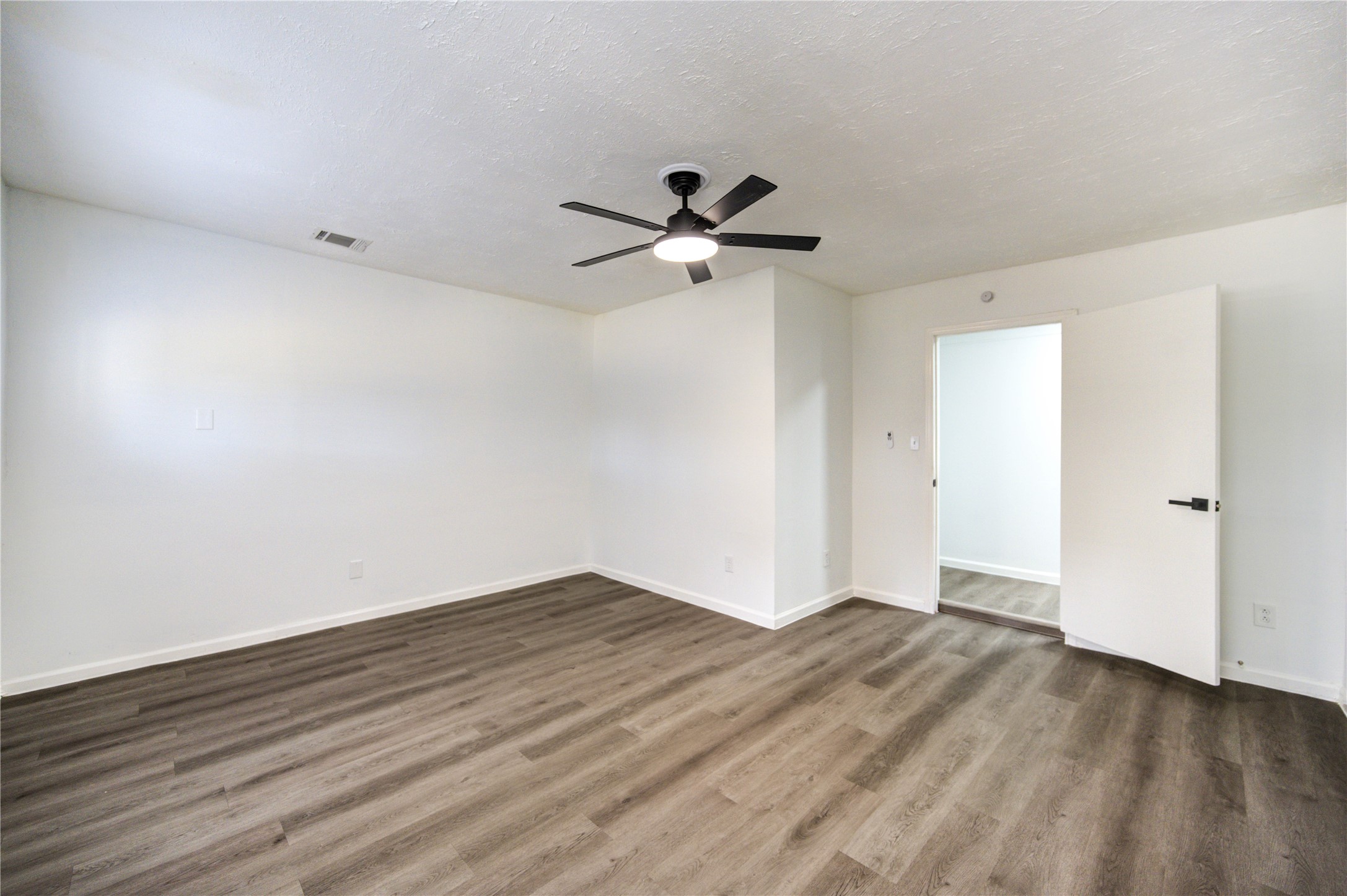 12127 Palmton Street Houston, TX 77034 - Photo 15 of 31 wooden floor in an empty room