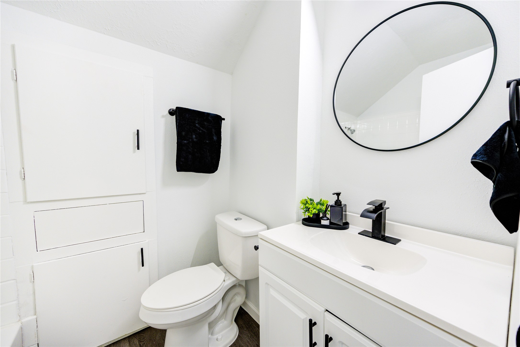 12127 Palmton Street Houston, TX 77034 - Photo 21 of 31 a bathroom with a sink a toilet and a mirror