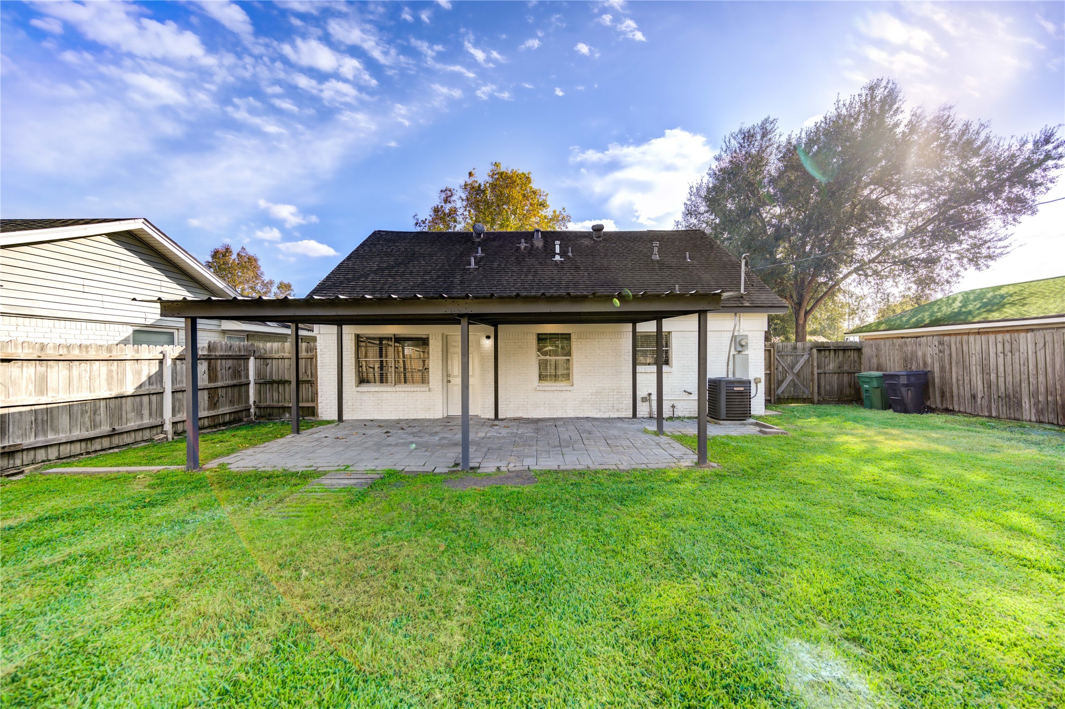 12127 Palmton Street Houston, TX 77034 - Photo 29 of 31 a front view of a house with a garden and yard