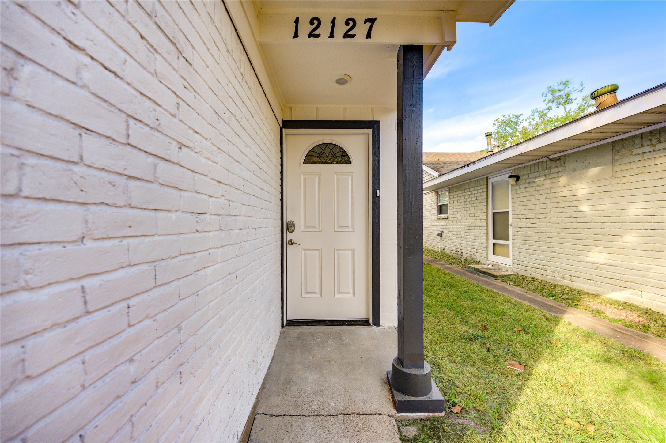 12127 Palmton Street Houston, TX 77034 - Photo 6 of 31 a front view of a house with garden