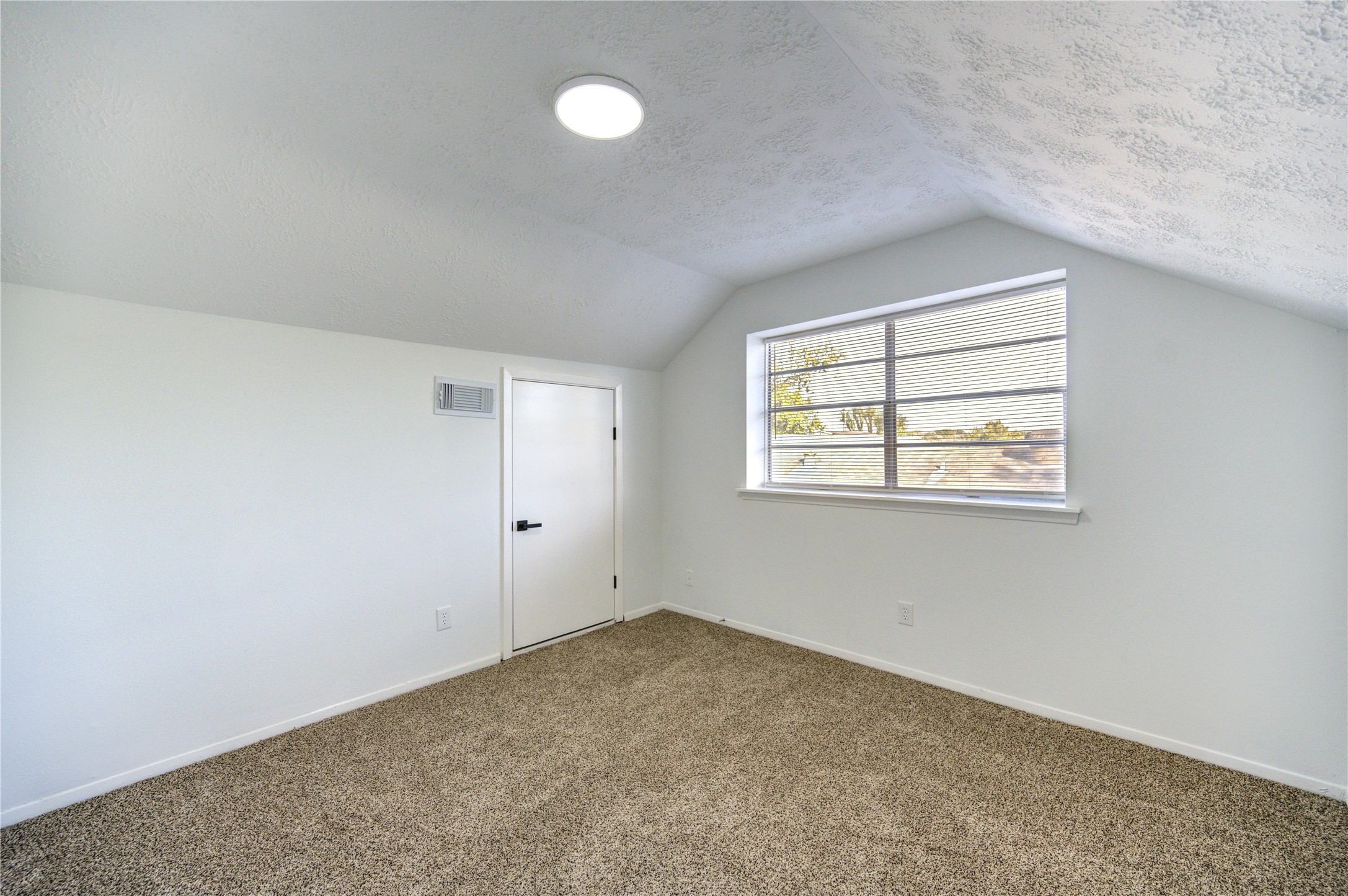 12127 Palmton Street Houston, TX 77034 - Photo 10 of 31 an empty room with windows