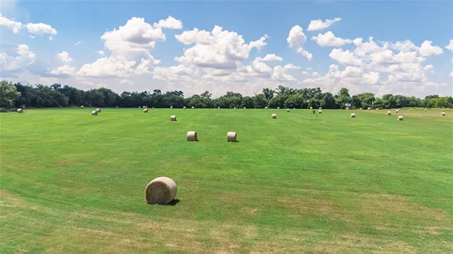 a backyard of a house with lots of green space