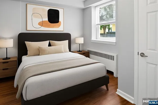 a bedroom with a bed and lamp