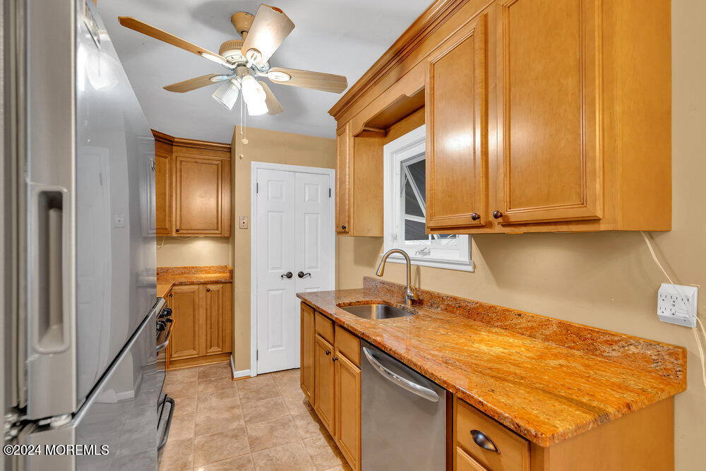 95 Solar Drive Brick, NJ 08724 - Photo 12 of 35 a kitchen with granite countertop a sink and cabinets