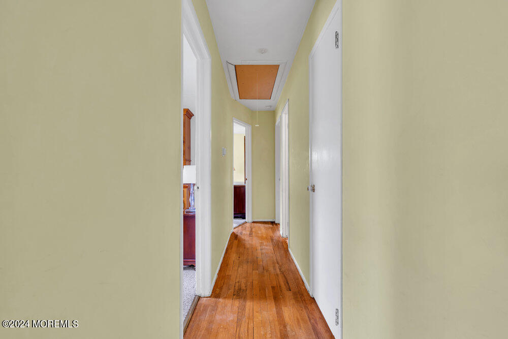 95 Solar Drive Brick, NJ 08724 - Photo 14 of 35 a view of a hallway with wooden floor and a door