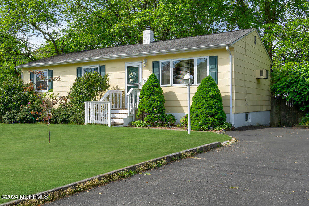 95 Solar Drive Brick, NJ 08724 - Photo 2 of 35 a front view of a house with a garden