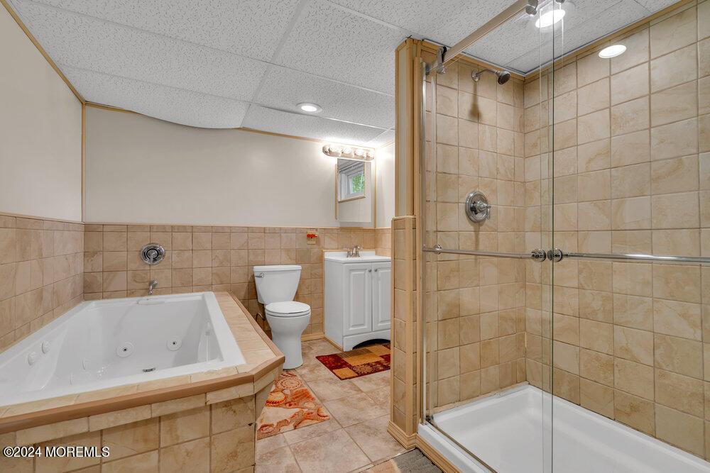 95 Solar Drive Brick, NJ 08724 - Photo 25 of 35 a bathroom with a bathtub and shower