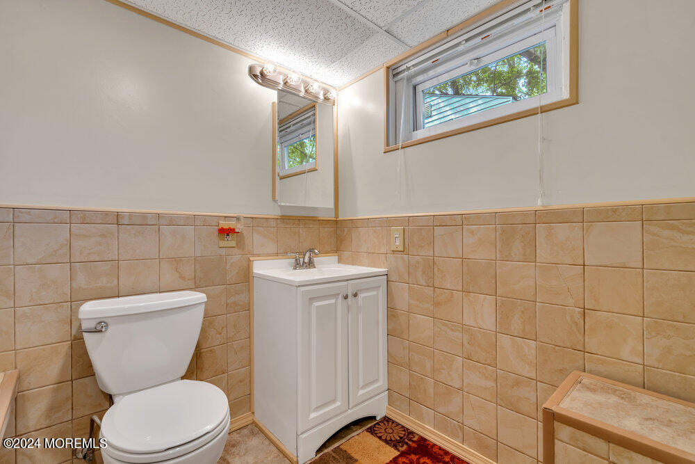 95 Solar Drive Brick, NJ 08724 - Photo 26 of 35 a white toilet sitting next to a bathroom sink