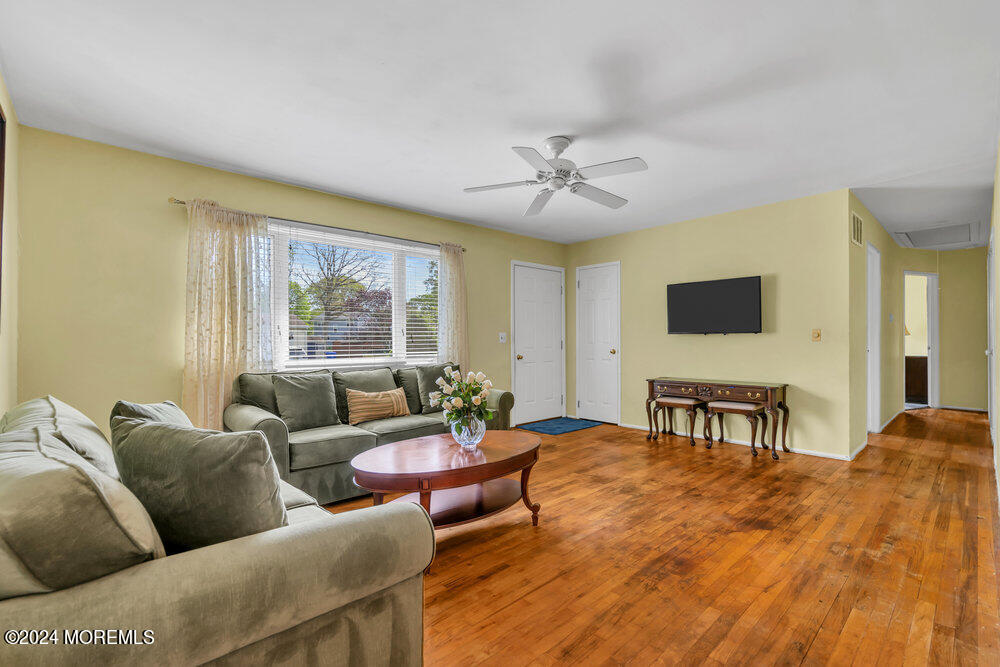 95 Solar Drive Brick, NJ 08724 - Photo 6 of 35 a living room with furniture wooden floor and a window