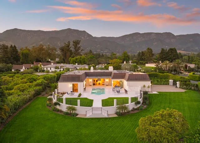 a view of a city with mountains in the background
