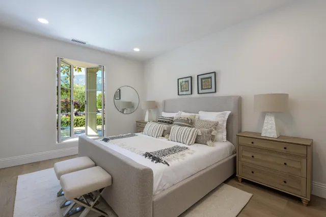 a bedroom with a bed and a couch