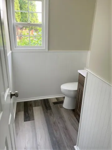 a bathroom with a toilet and a sink