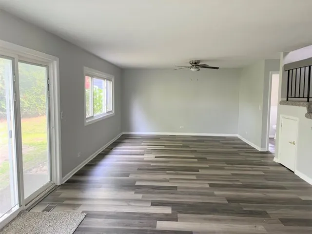 a view of room window and wooden floor