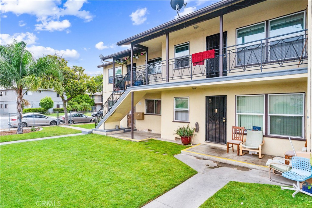 1173 North Mayfair Avenue Anaheim, CA 92801 - Photo 5 of 6 a front view of house with yard and swimming pool