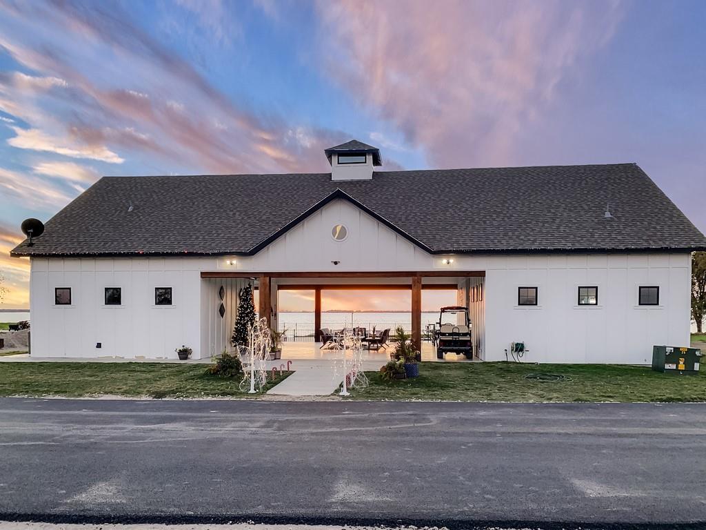 6397 Peninsula Road, Unit 132 Kerens, TX 75144 - Photo 12 of 15 a front view of a house with a yard