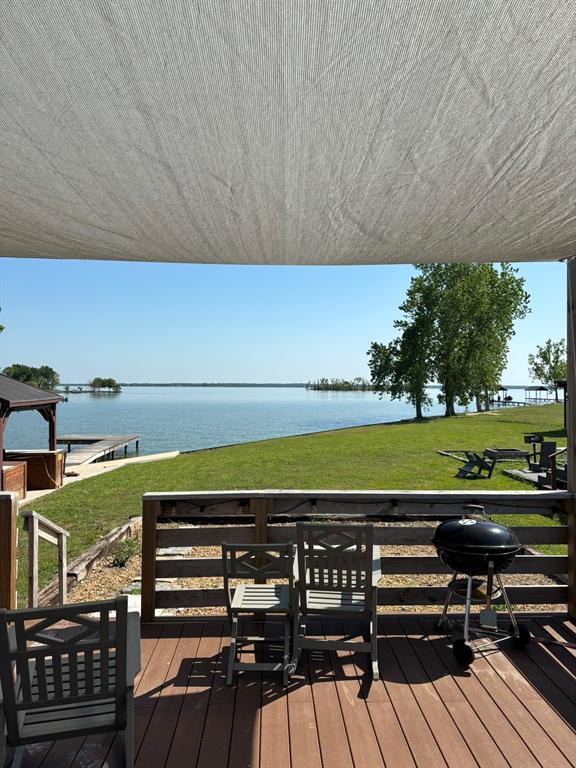 6397 Peninsula Road, Unit 132 Kerens, TX 75144 - Photo 2 of 15 a view of a swimming pool with a patio and a yard