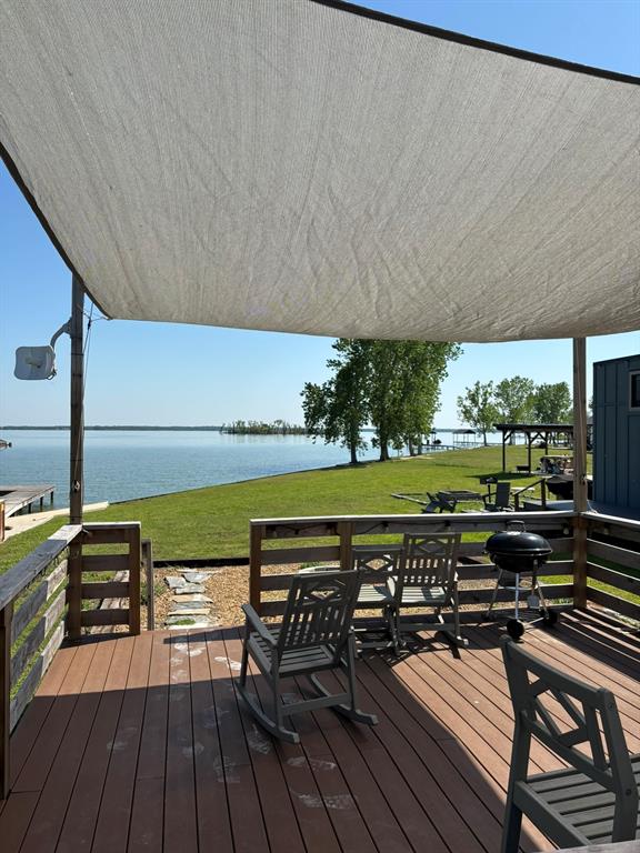 6397 Peninsula Road, Unit 132 Kerens, TX 75144 - Photo 3 of 15 a view of a swimming pool with a patio