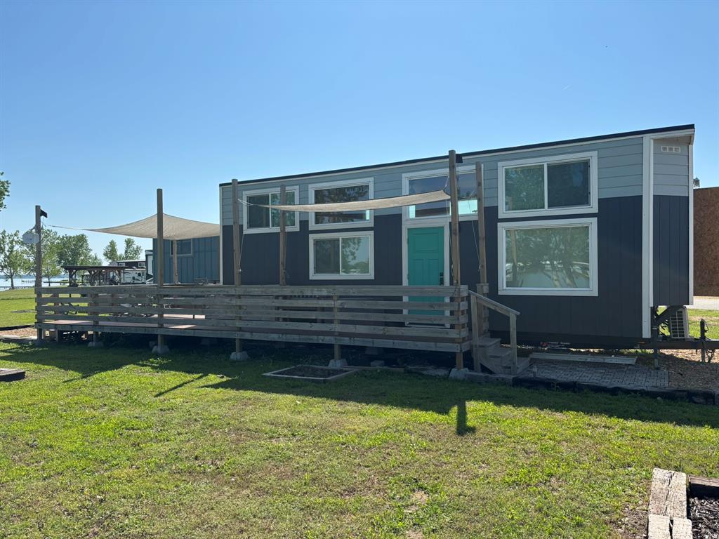 6397 Peninsula Road, Unit 132 Kerens, TX 75144 - Photo 7 of 15 a view of a house with swimming pool and sitting area