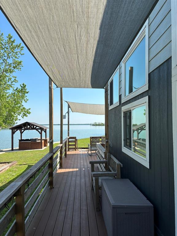 6397 Peninsula Road, Unit 132 Kerens, TX 75144 - Photo 8 of 15 a view of a balcony with chairs