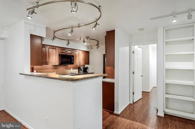 a view of living room with granite countertop furniture and fireplace