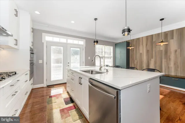 a bathroom with a sink a vanity a mirror and a shower