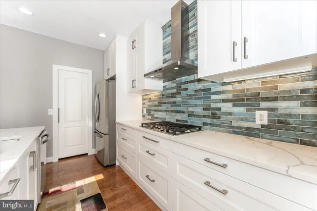 a kitchen with a stove and a refrigerator