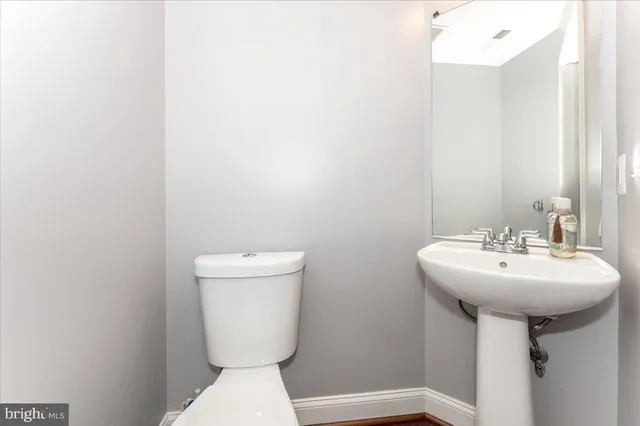 a front view of house with yard outdoor seating and barbeque oven