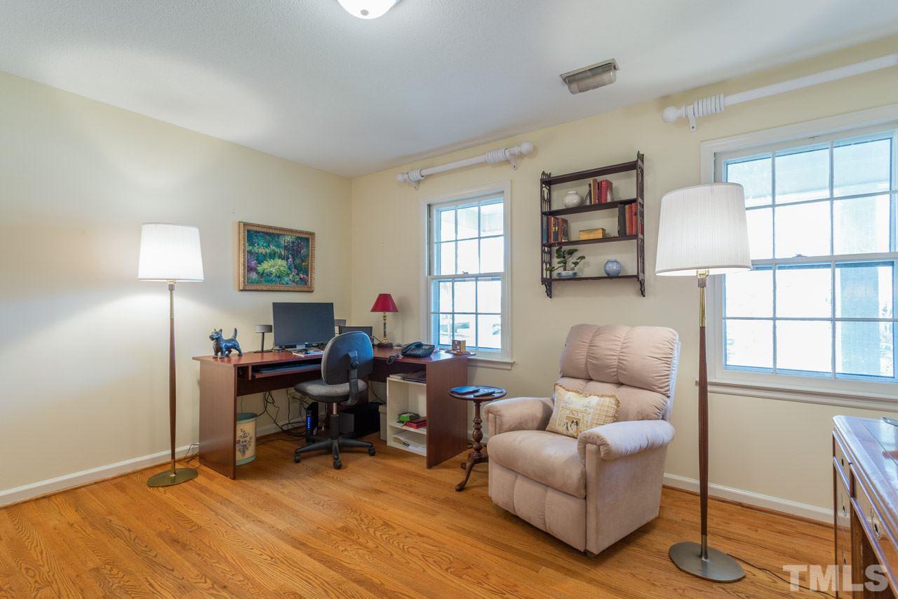 7616 Harps Mill Road Raleigh, NC 27615 - Photo 18 of 24 Currently used as an office, this wonderful room has hardwood floors and access to the large walk-in attic.