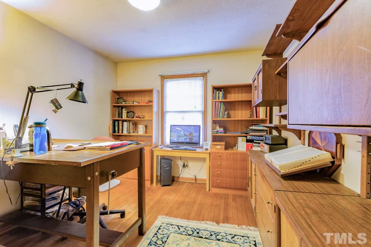 7616 Harps Mill Road Raleigh, NC 27615 - Photo 20 of 24 This versatile room is located just off the kitchen and features hardwood floors and a closet.
