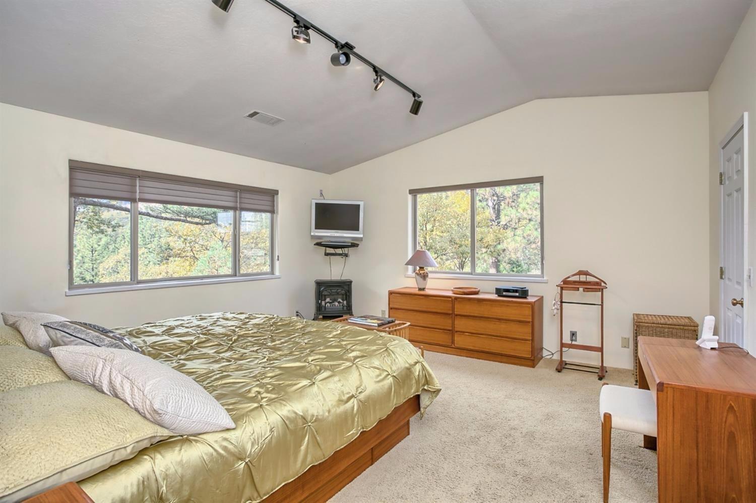 8009 Dead Indian Memorial Road Ashland, OR 97520 - Photo 22 of 24 a bedroom with a bed and a window