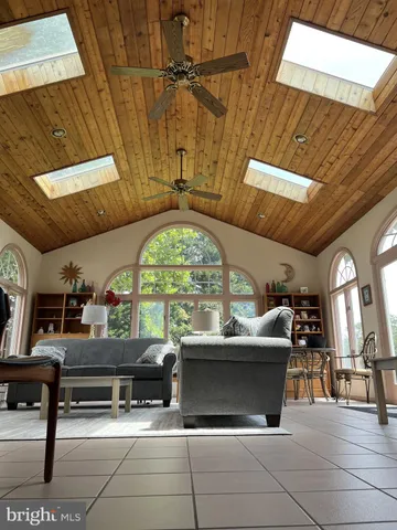 a lobby with furniture and a floor to ceiling window