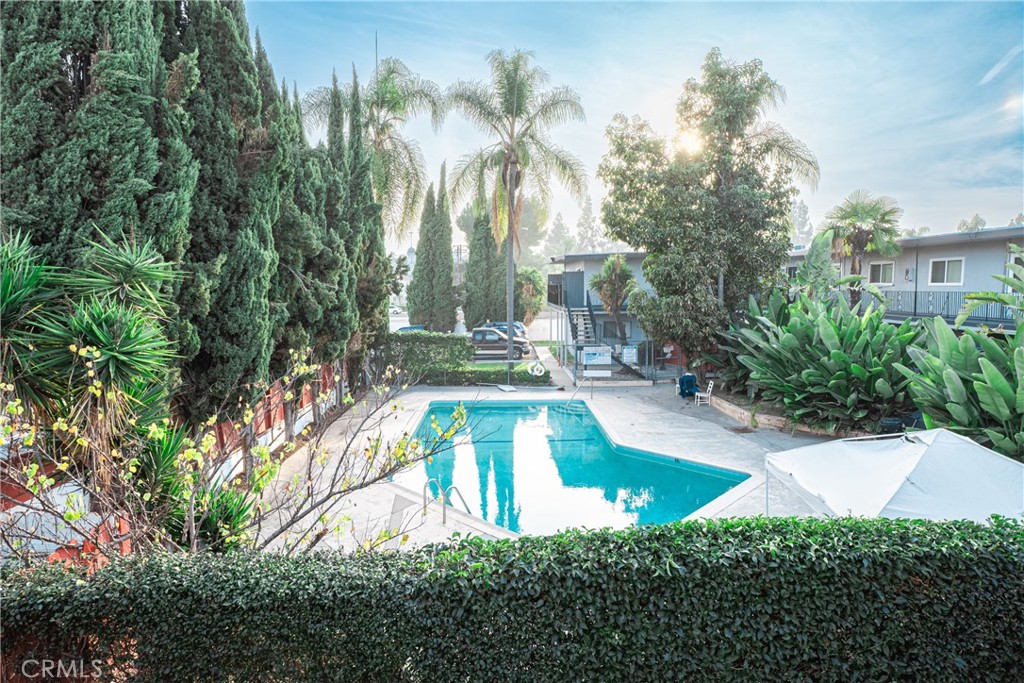 7348 Florence Avenue, Unit 4 Downey, CA 90240 - Photo 12 of 16 a view of a swimming pool with a patio