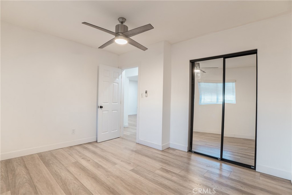 7348 Florence Avenue, Unit 4 Downey, CA 90240 - Photo 7 of 16 wooden floor in an empty room