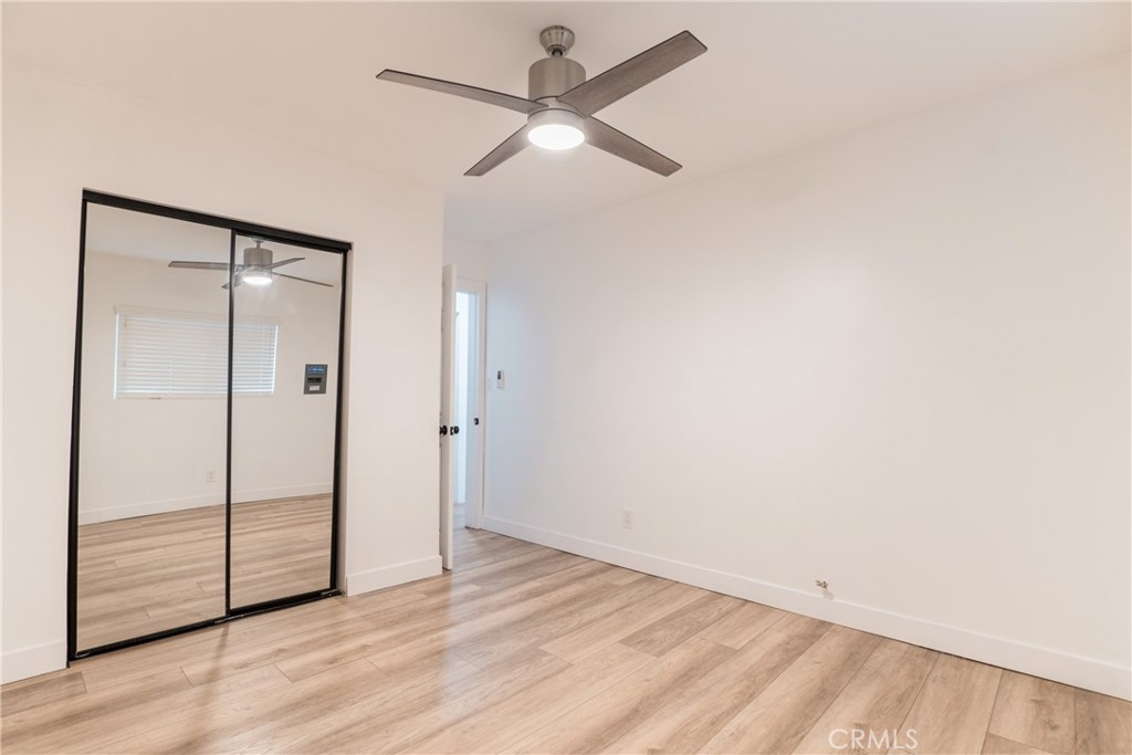 7348 Florence Avenue, Unit 4 Downey, CA 90240 - Photo 9 of 16 wooden floor in an empty room