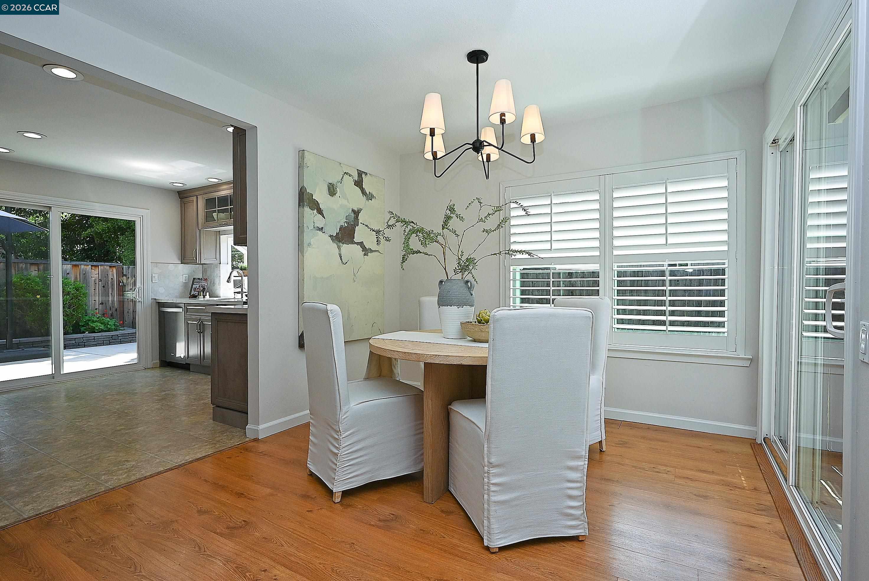 4284 Dubhe Court Concord, CA 94521 - Photo 12 of 46 a view of a dining room with furniture window and wooden floor