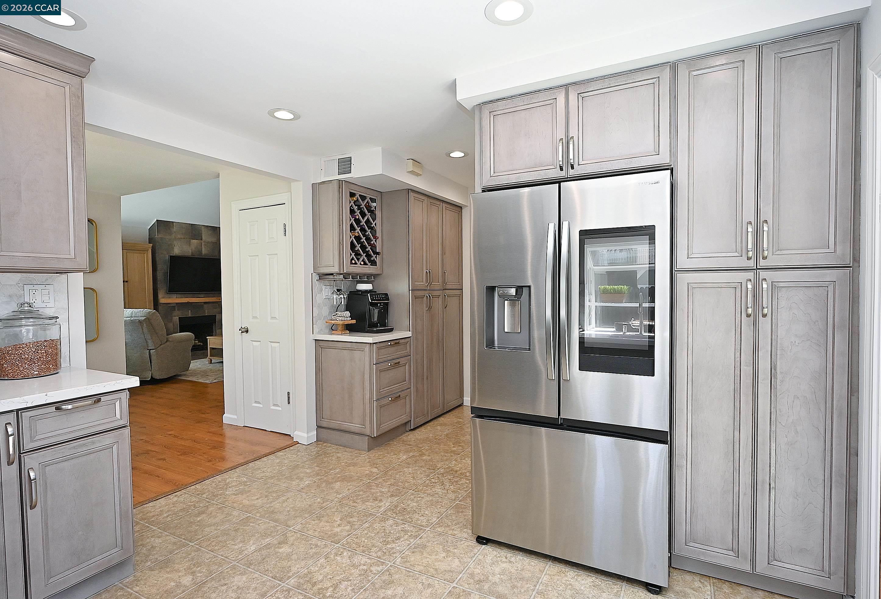 4284 Dubhe Court Concord, CA 94521 - Photo 13 of 46 a kitchen with stainless steel appliances a refrigerator sink and cabinets