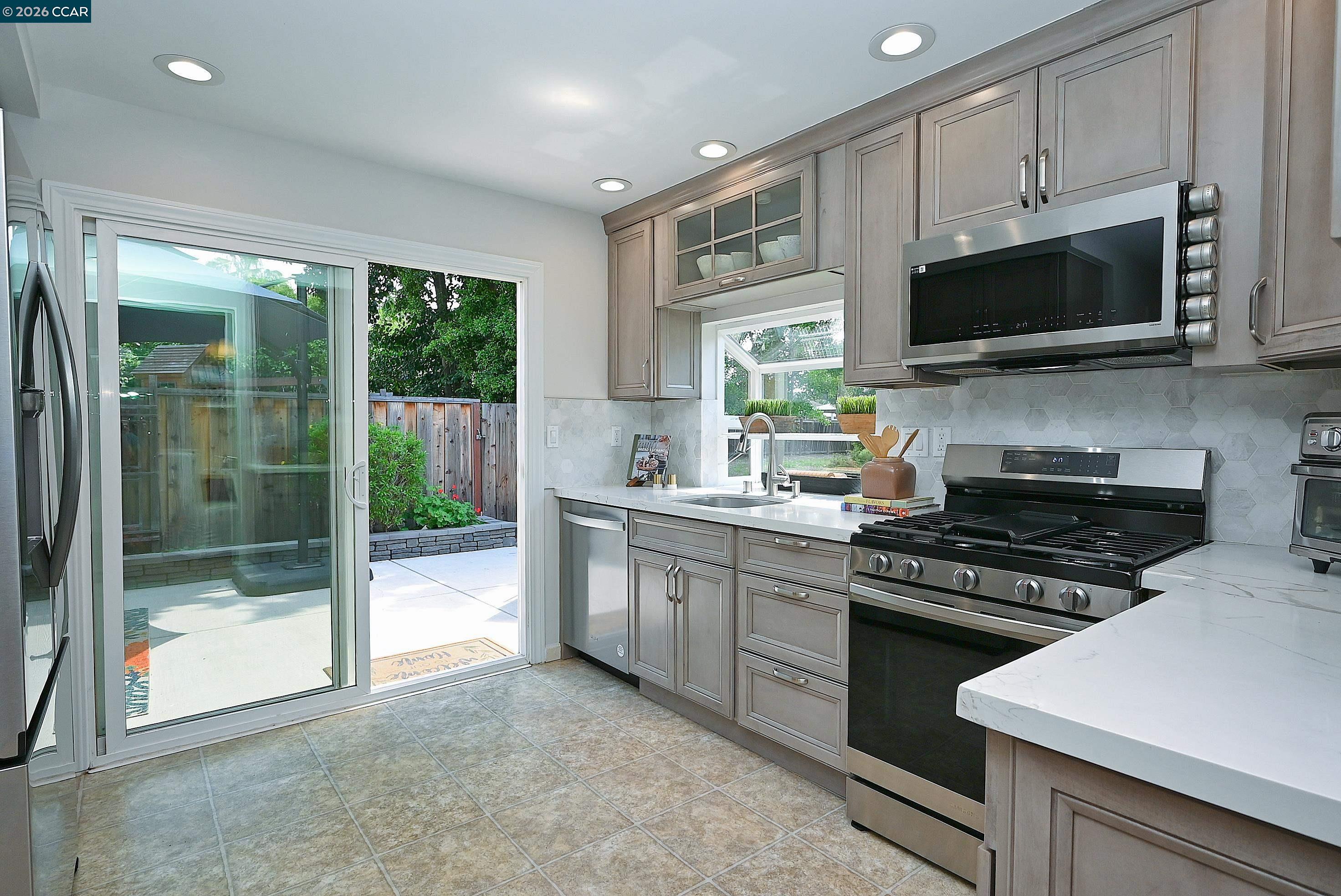 4284 Dubhe Court Concord, CA 94521 - Photo 15 of 46 a kitchen with stainless steel appliances a stove sink and microwave
