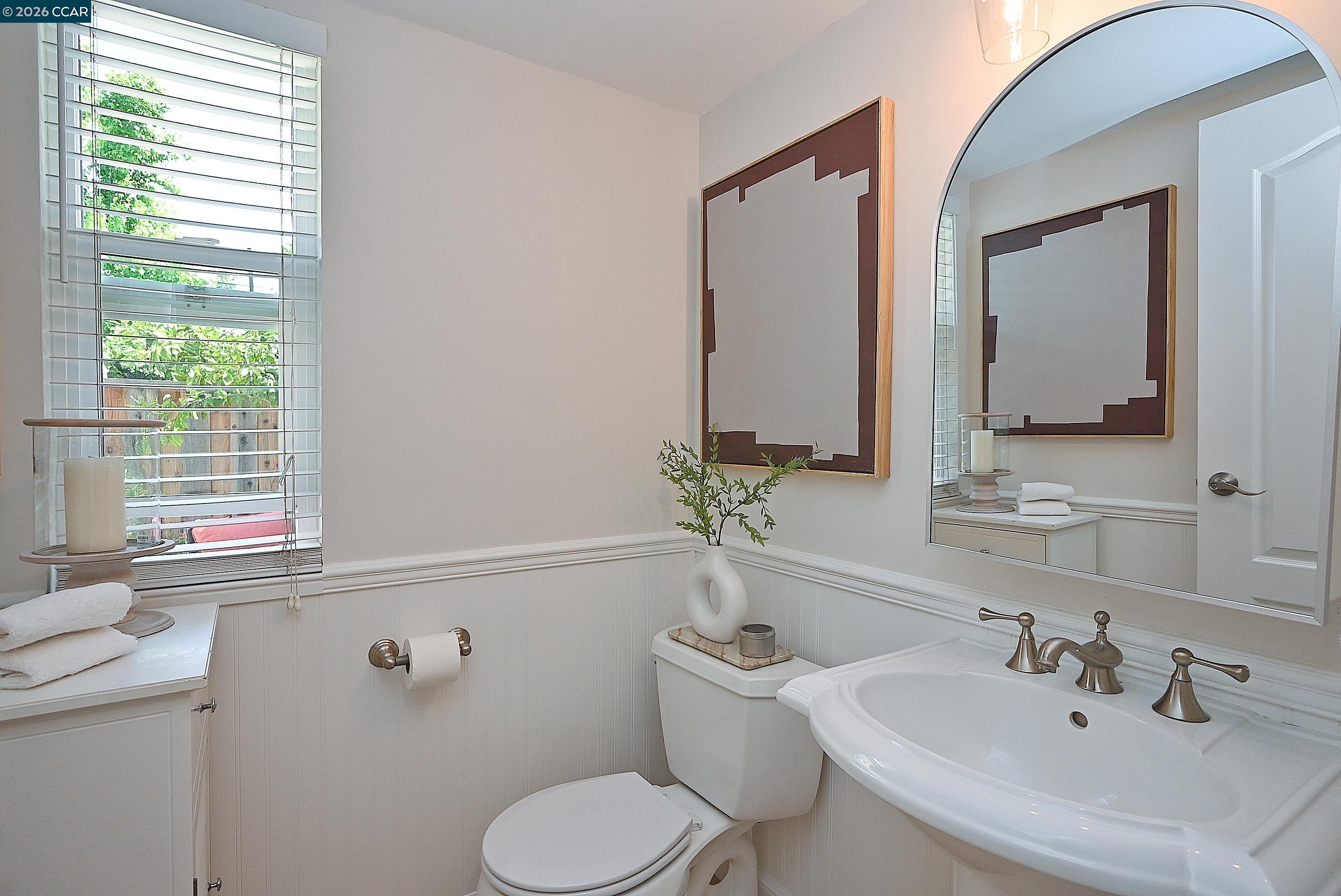 4284 Dubhe Court Concord, CA 94521 - Photo 23 of 46 a bathroom with a toilet sink and mirror