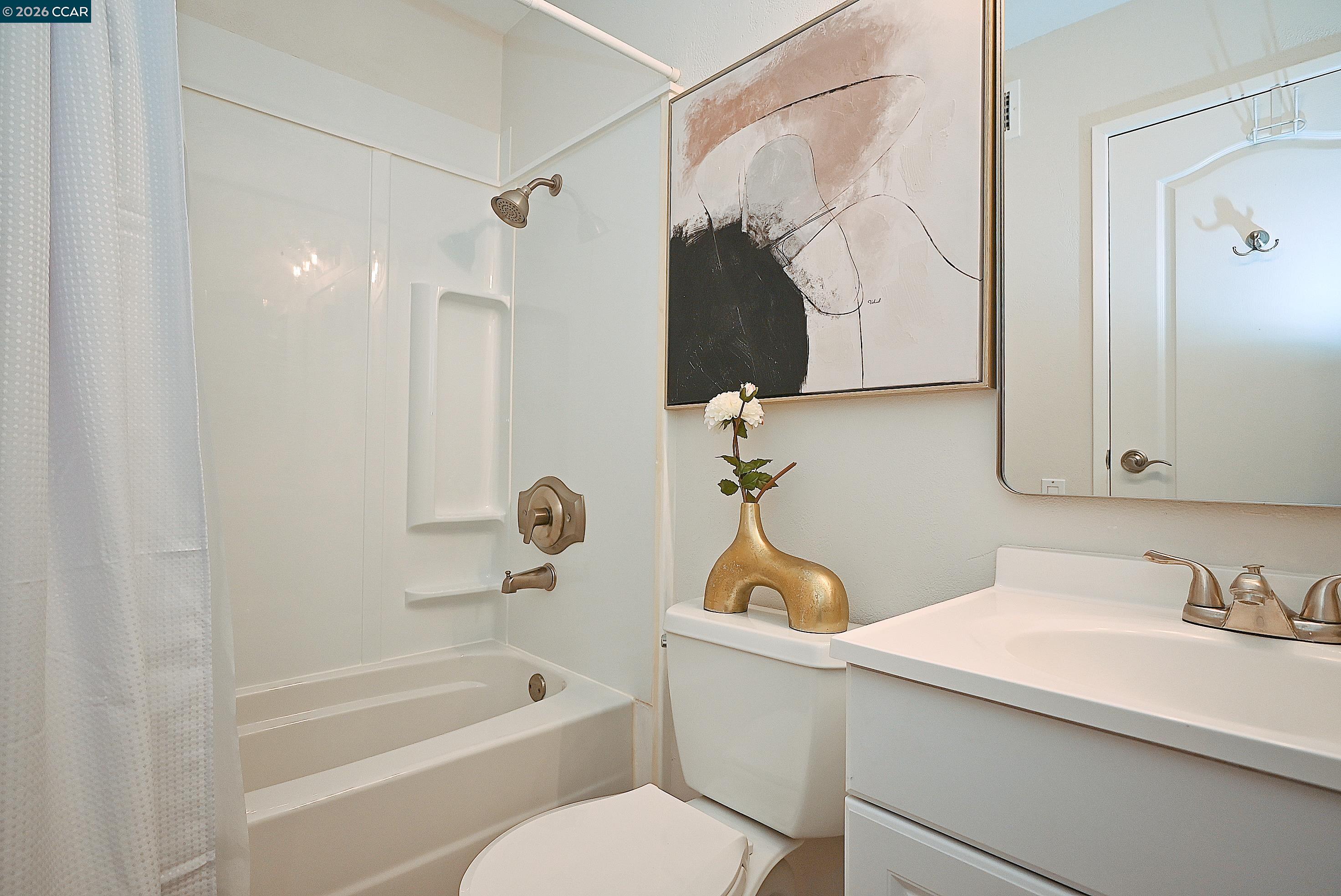 4284 Dubhe Court Concord, CA 94521 - Photo 25 of 46 a bathroom with a sink a toilet and a bathtub