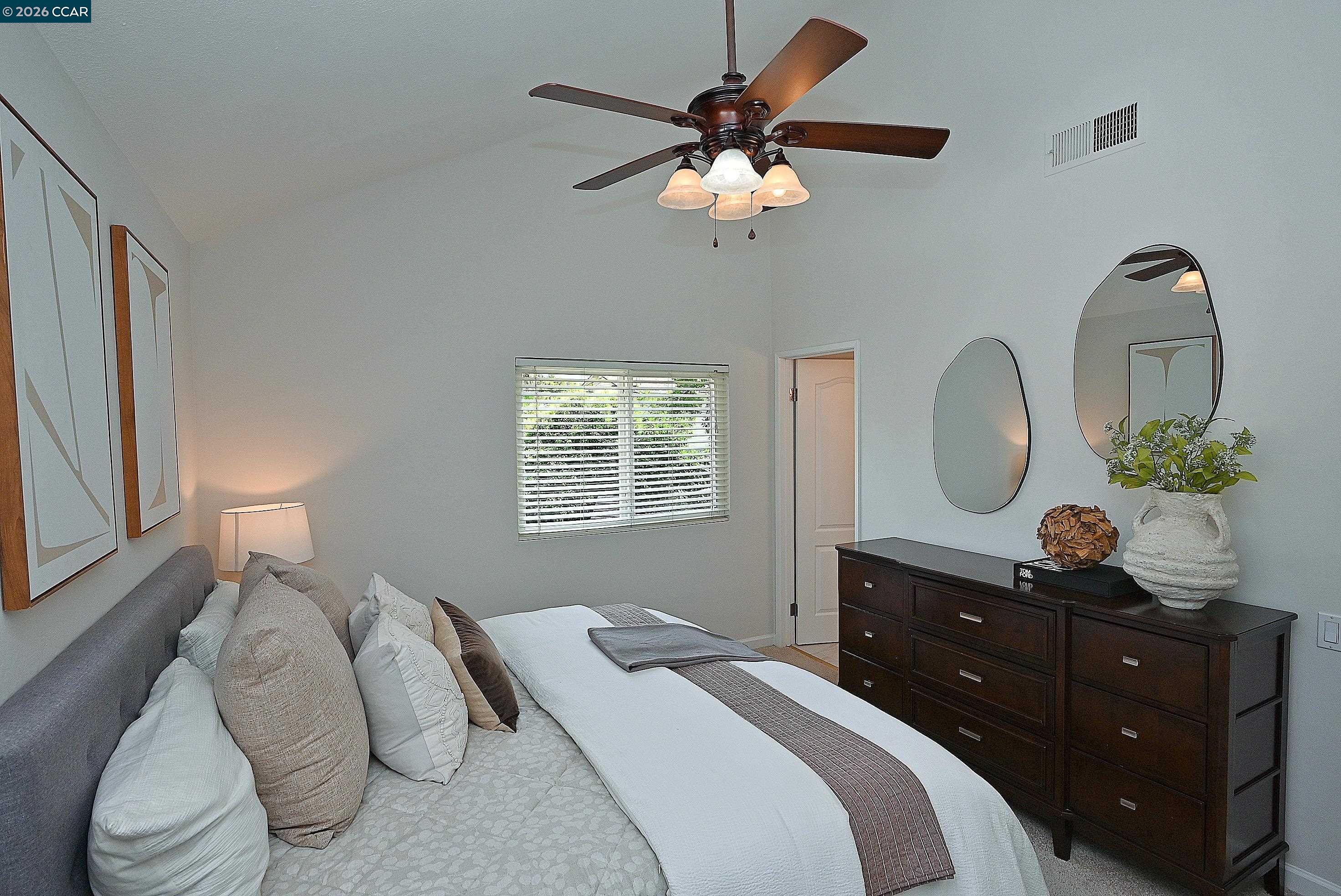 4284 Dubhe Court Concord, CA 94521 - Photo 28 of 46 a bedroom with a bed and a chandelier